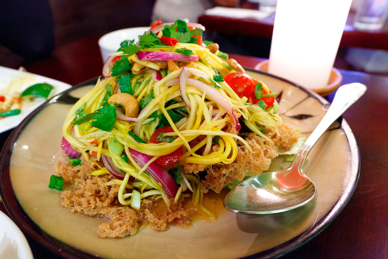 Crispy catfish salad with green mango and spicy lime dressing ($15)