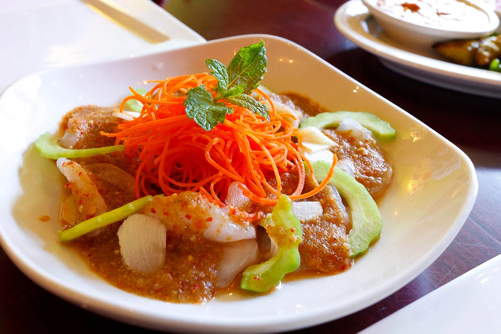 Raw shrimp topped with garlic, chili, and lime juice ($9)