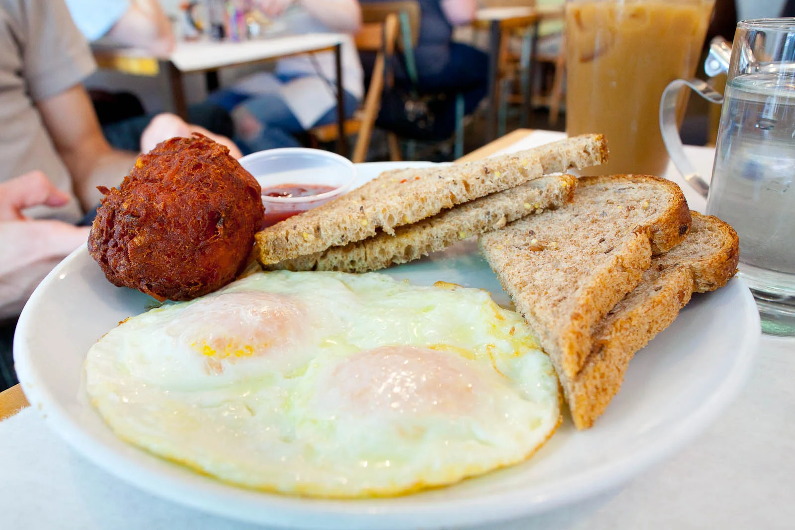 Two eggs over easy with 5-grain toast and hashbrowns ($8.50)