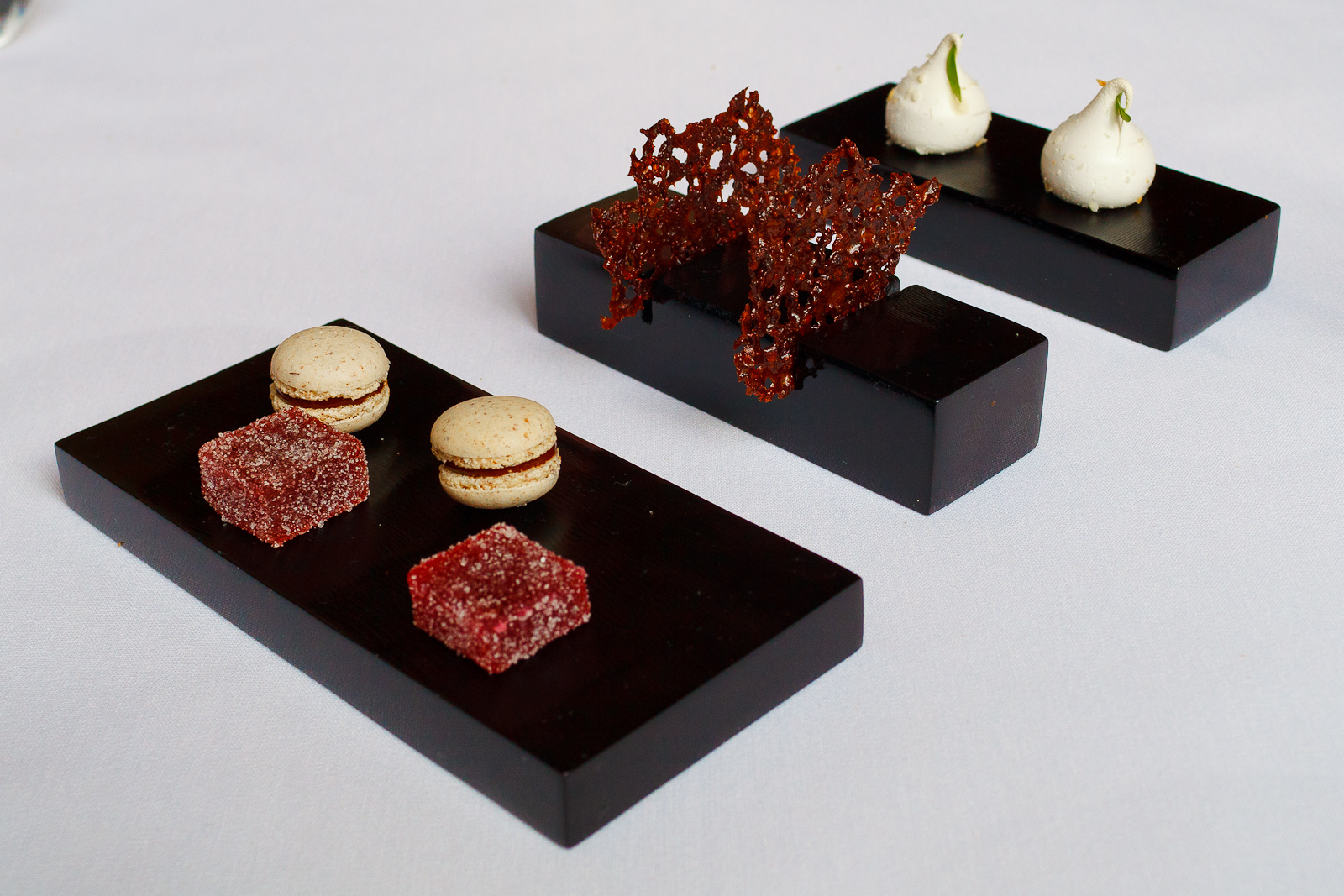 Petits Fours: Raspberry pâtes de fruits, chocolate macaron, cacao nib tuiles, passionfruit meringue