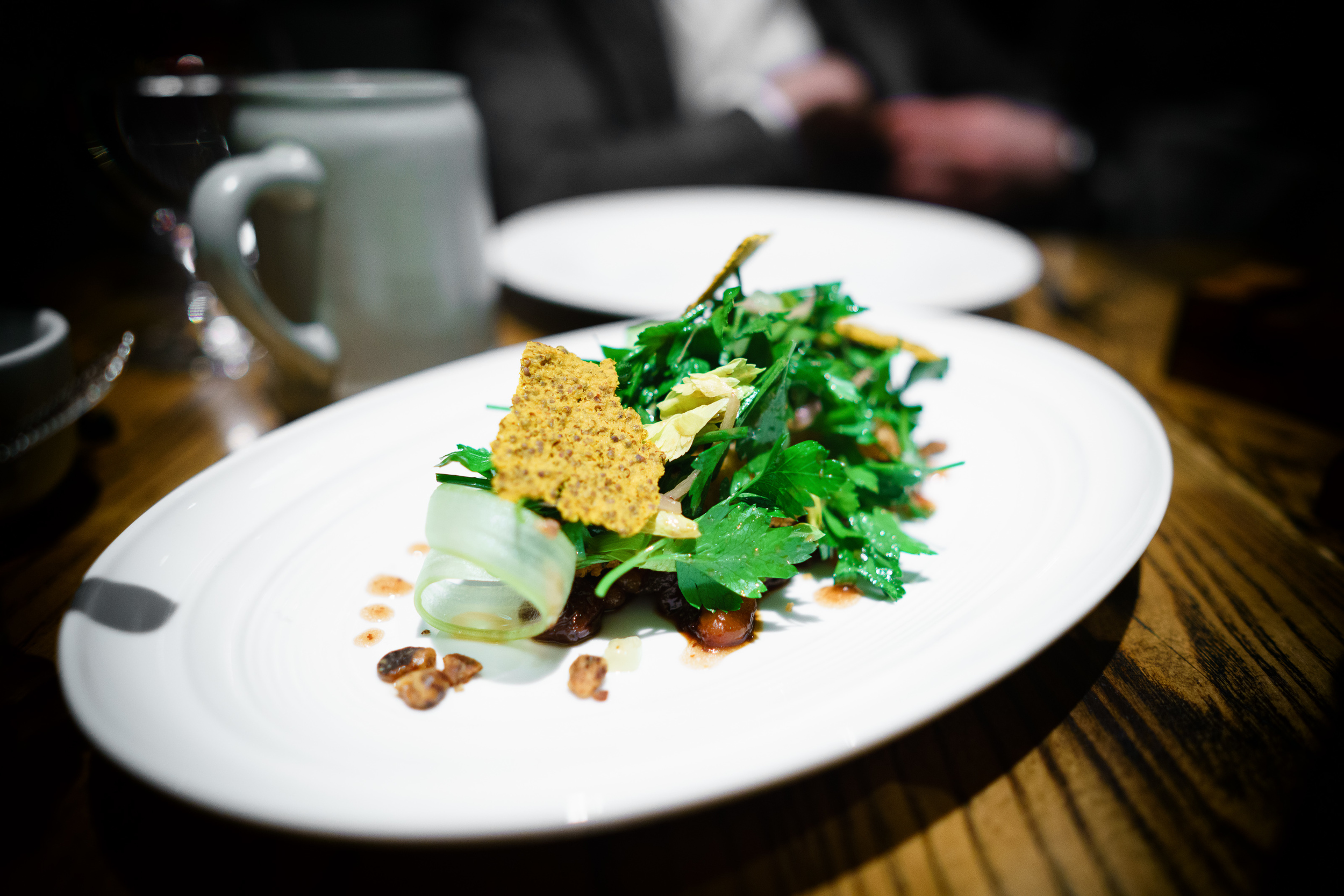 Pork belly schnitzel with cherry and black walnut