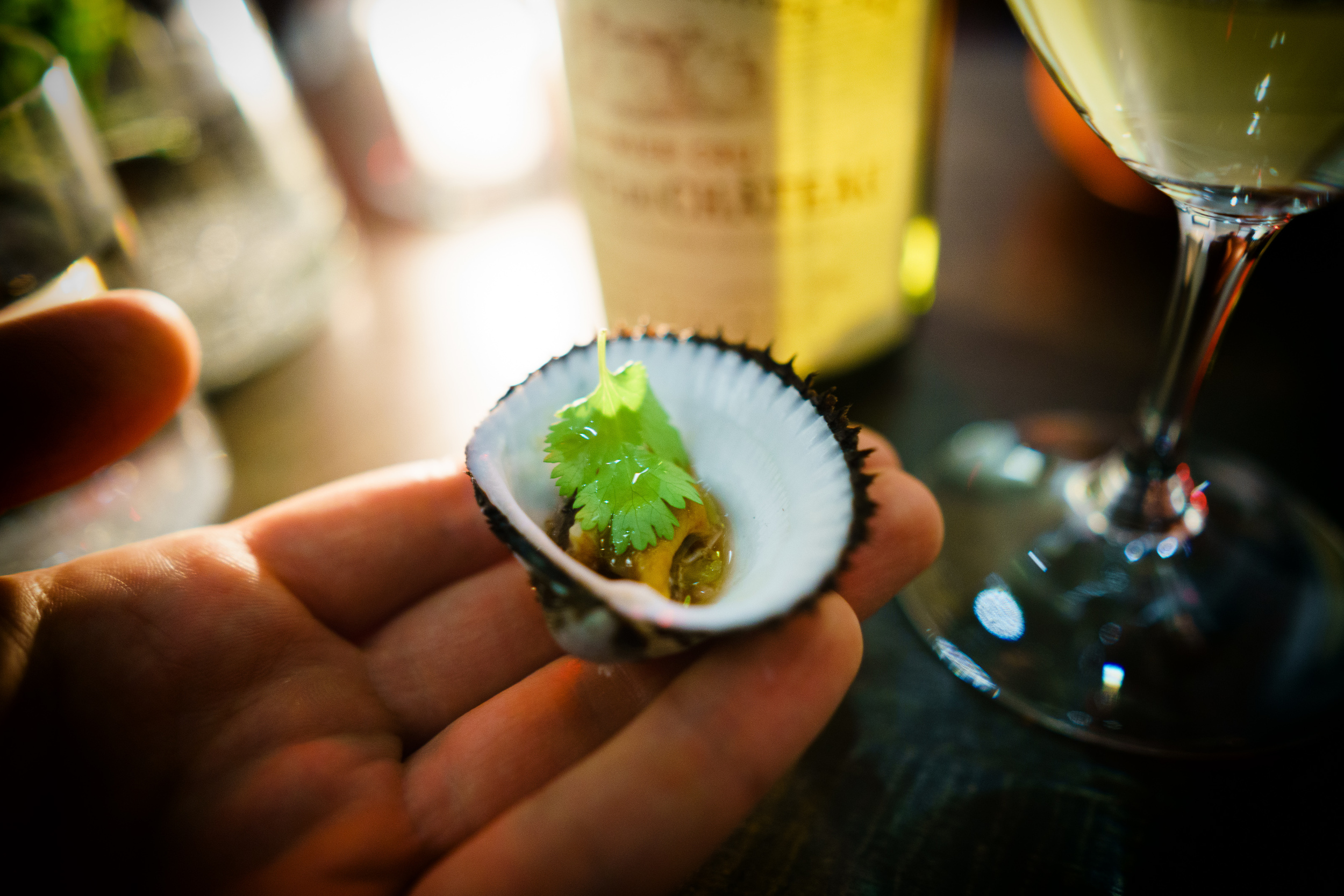 Blood clams (from Massachusetts) warm in pork fat, mignonette with the blood from clams and green peppercorn