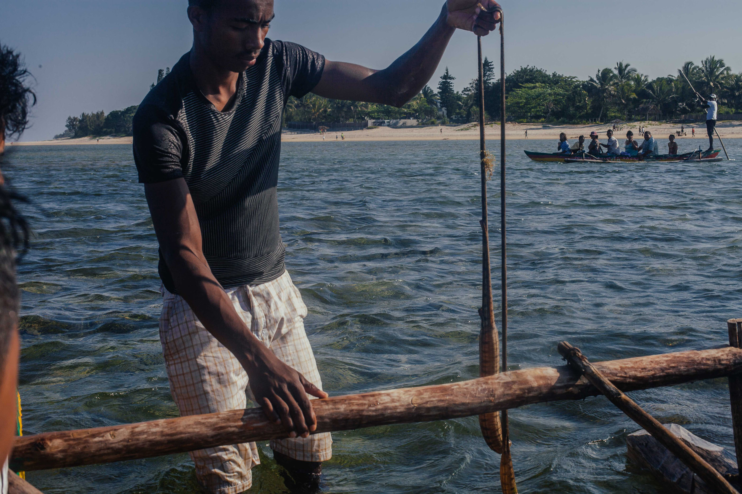 The man in charge of our canoe showing us a sea snake. 