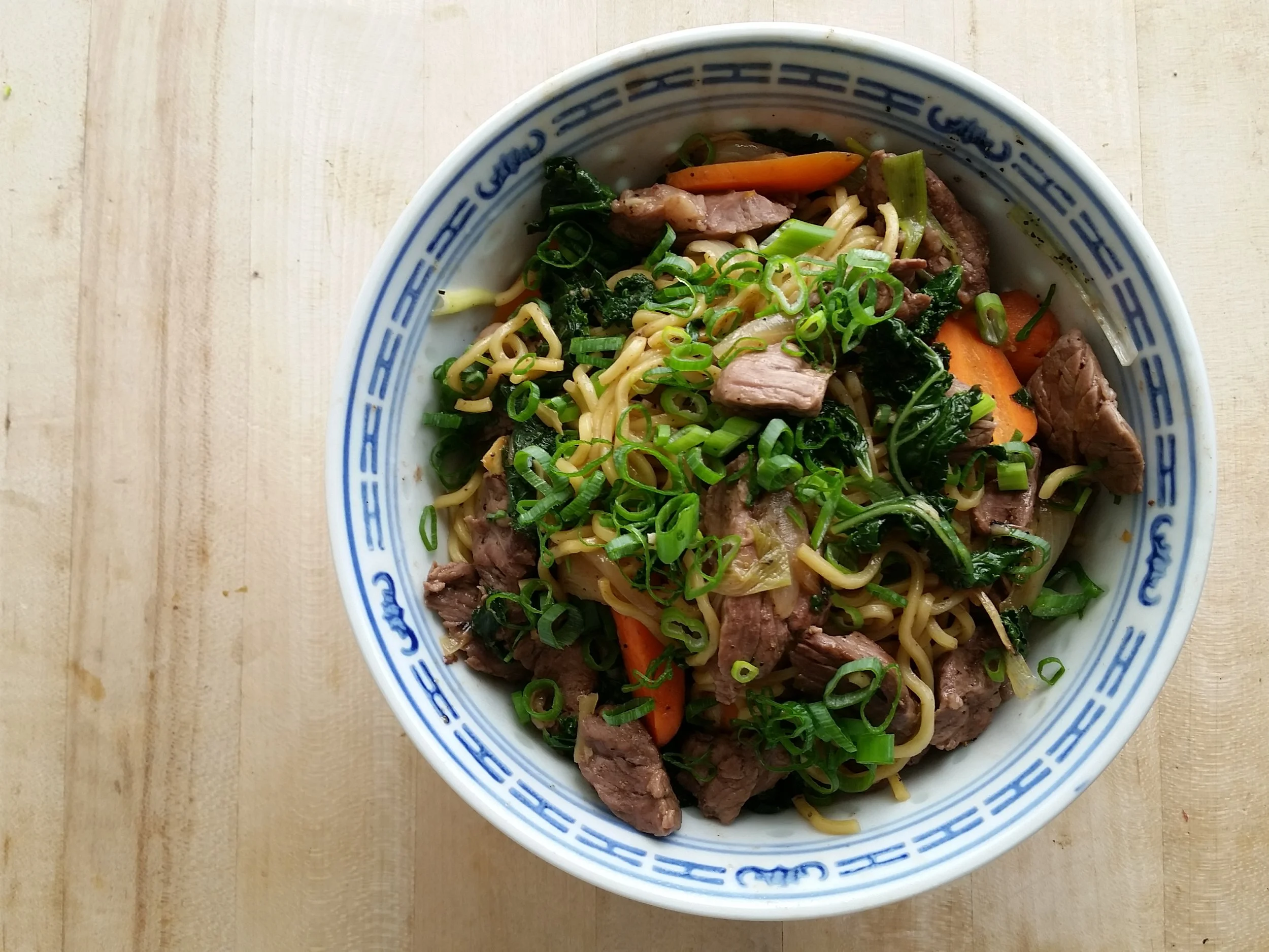 ginger beef over curried noodles top round, yakisoba, market vegetables