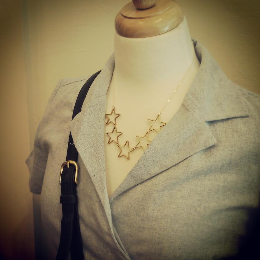 Star necklace by Lanaypi $54, Bride and Burn Dress Warp Dress $80, Vintage Coach Purse $72