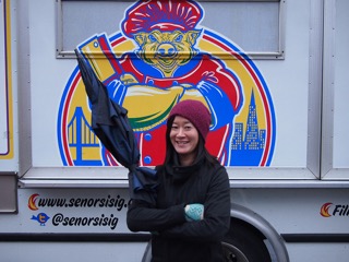 Joanne in front of their favorite food truck.