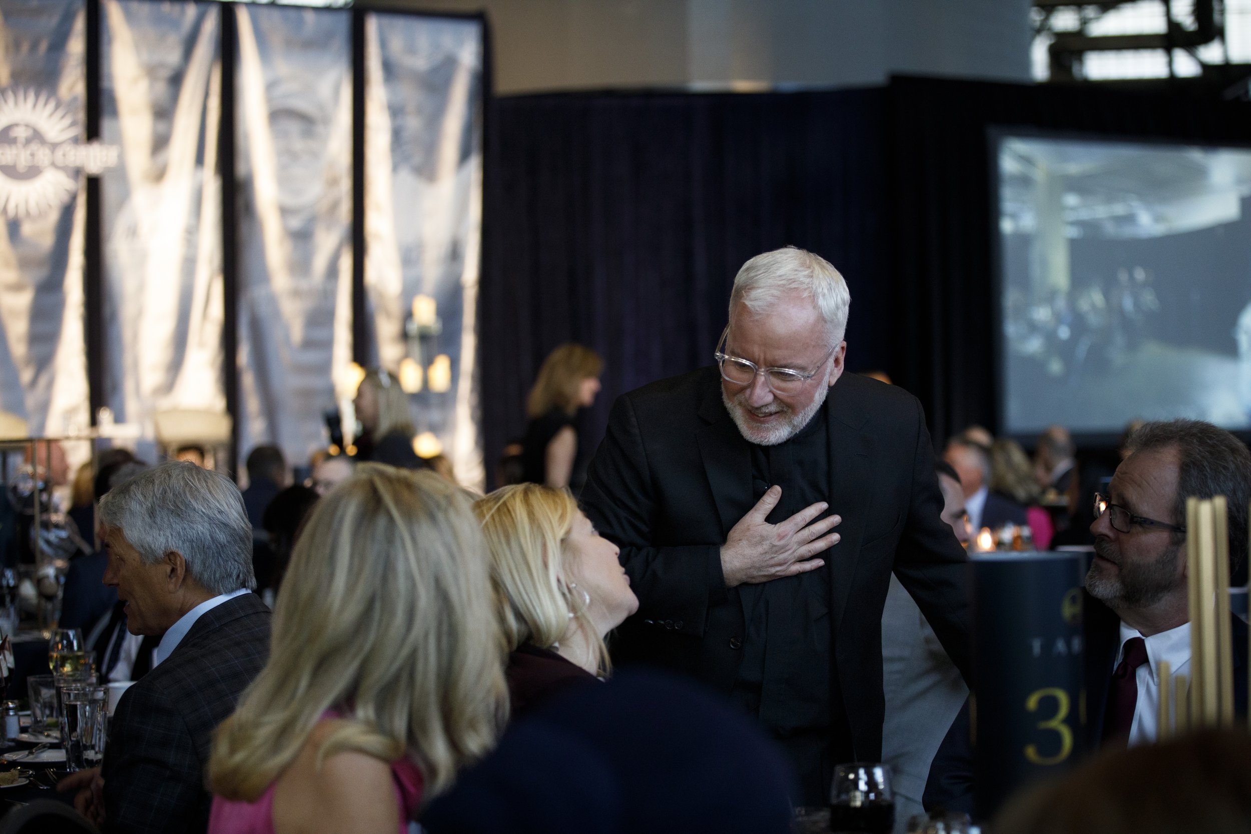 A collection of photography demonstrating Visual storytelling photography for the Detroit non profit The Pope Francis Center Building Bridges Gala in Detroit, Michigan 