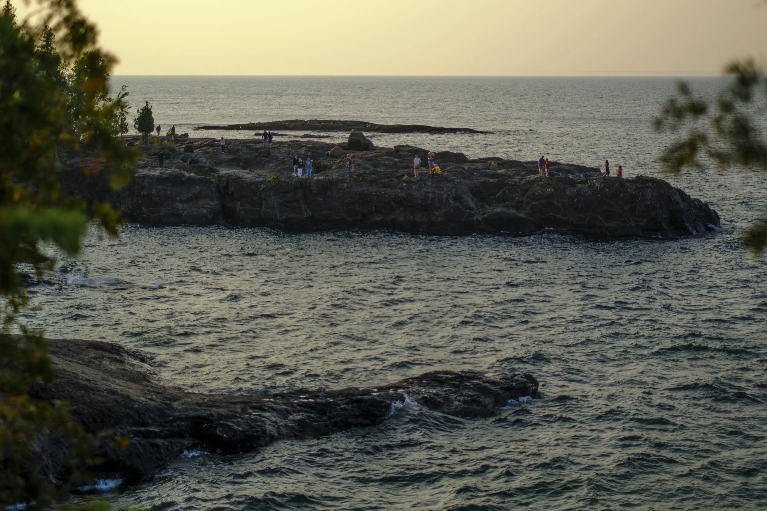 A photo of Black Rocks off Presque Isle in Marquette Michigan during sunset in the Upper Peninsula of Michigan.