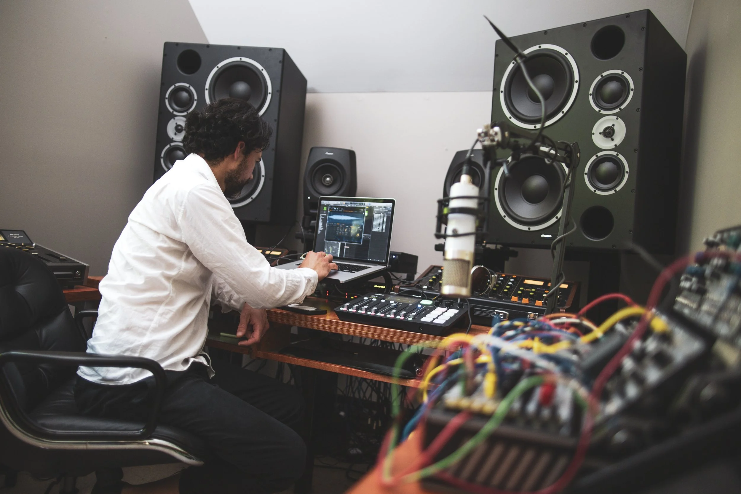 Documentary photograph of electronic musician Matthew Dear working in the recording studio during the creation of New Breed.
