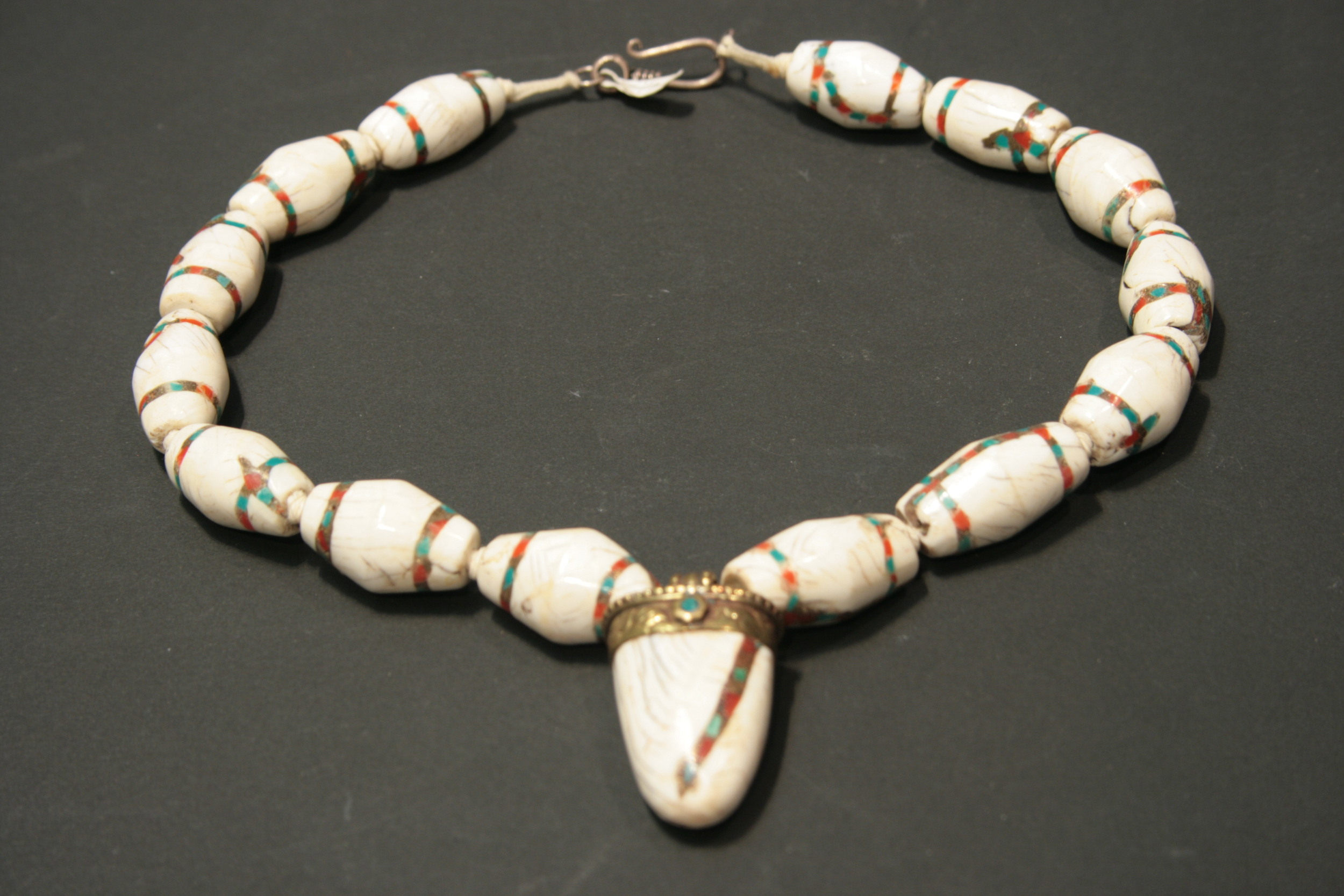 Old Tibetan shell necklace with inlaid turquoise and coral