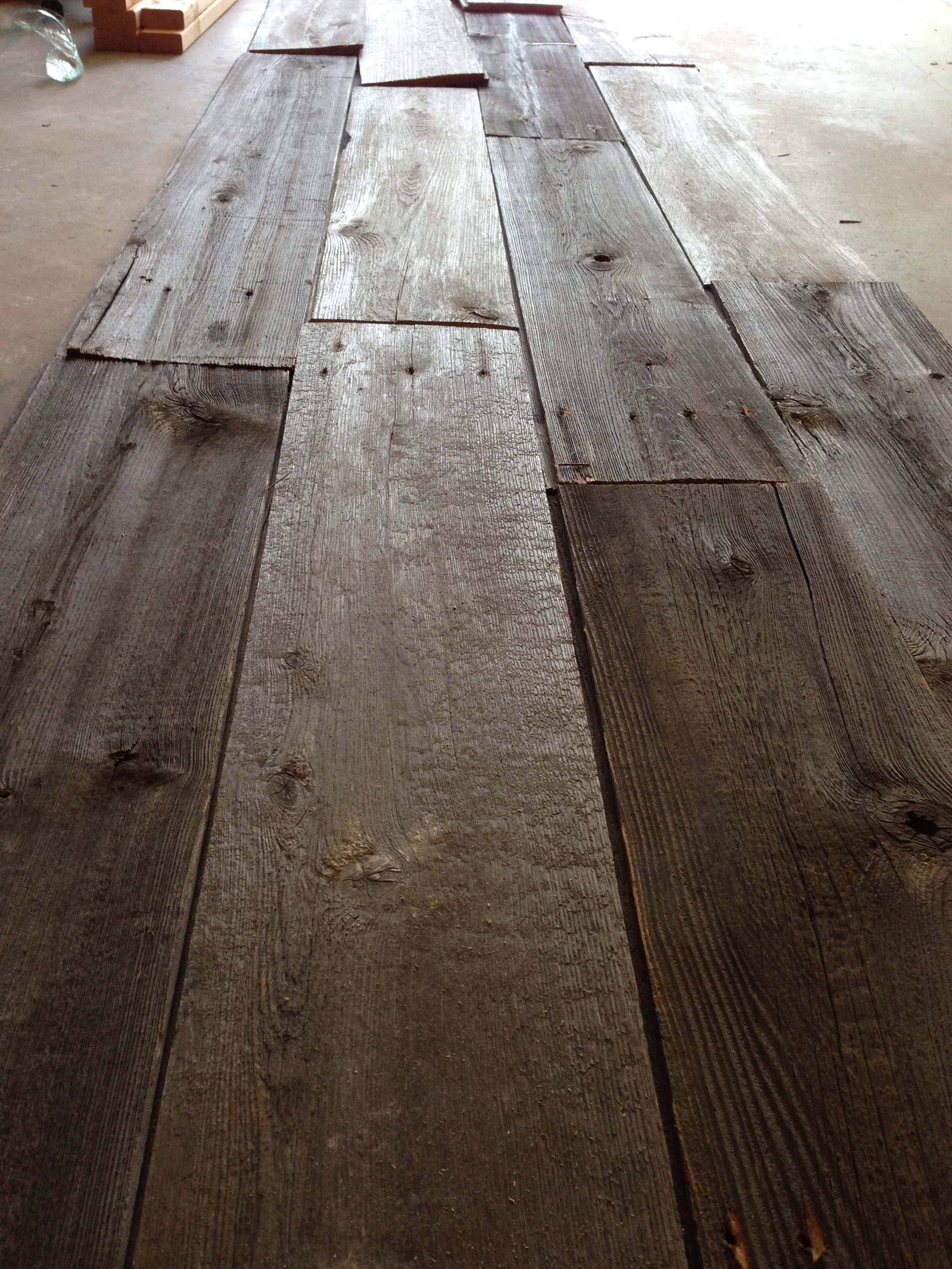 Reclaimed barn wood will wrap the back of the island and the peninsula.