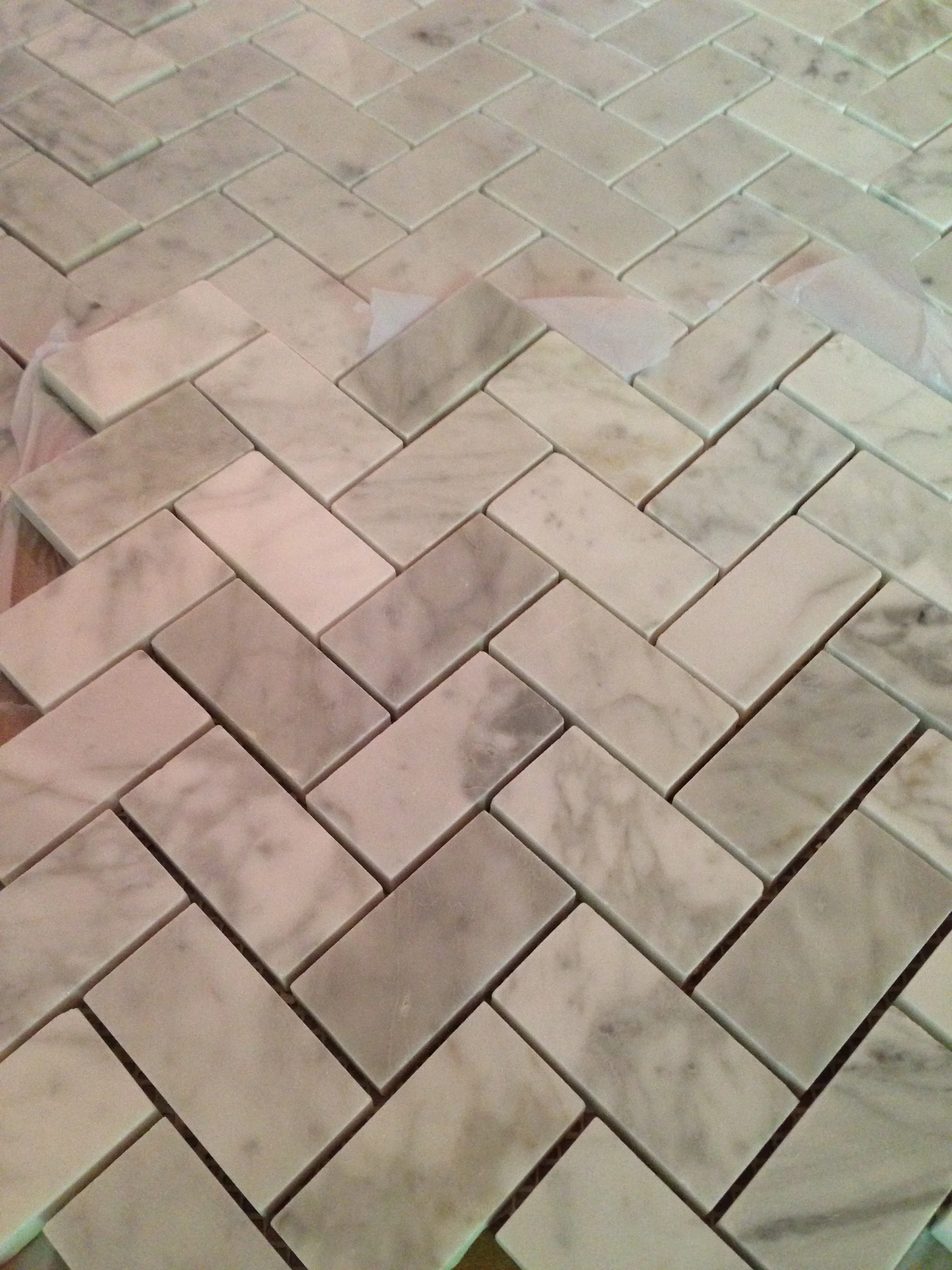 1 x 2 Carrara Herringbone backsplash