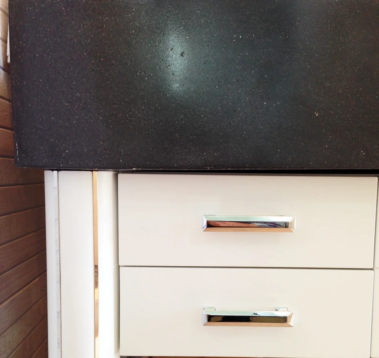 Polished chrome accents with white paint finish and black concrete is a great combination. 