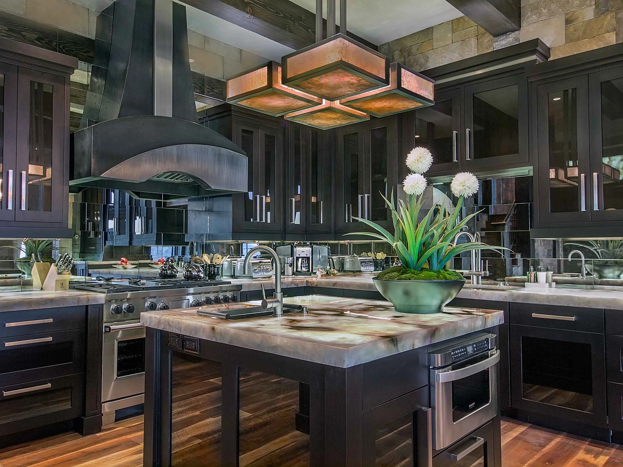 Cabinetry, hardware,and hood concept by Chris Awadalla. Lighting, countertops, and backsplash by Annette Phan.