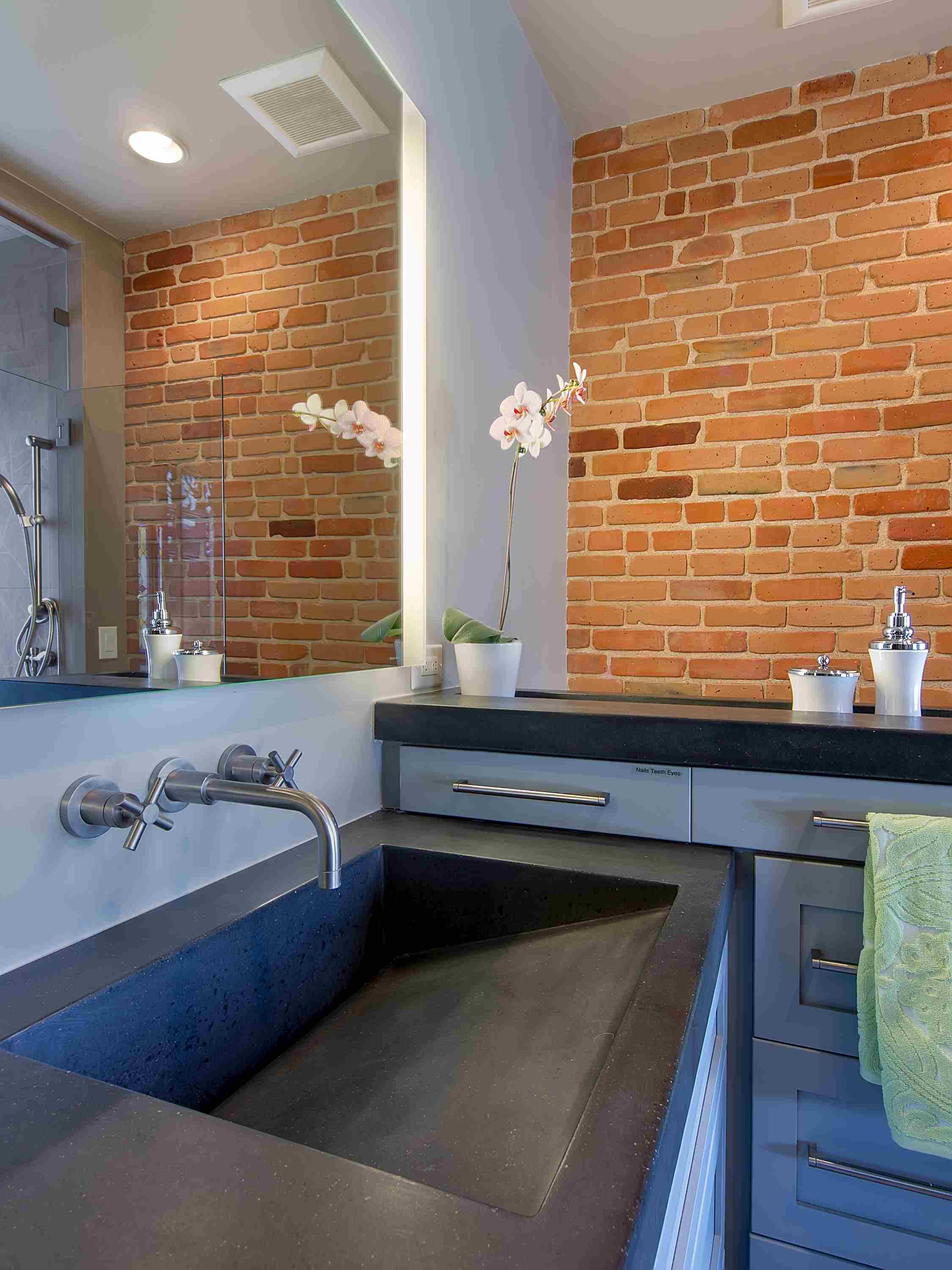 exposed brick and concrete — sanctuary kitchen and bath desi-3.jpg