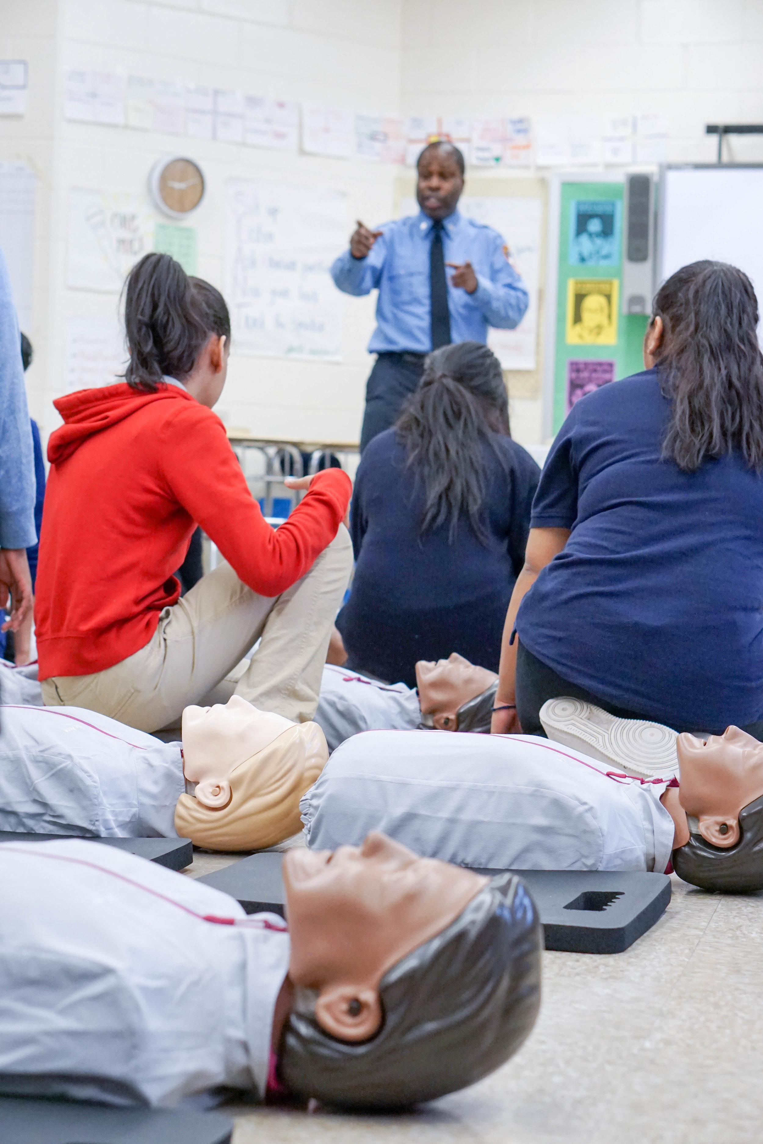 Students learning about CPR in classroom