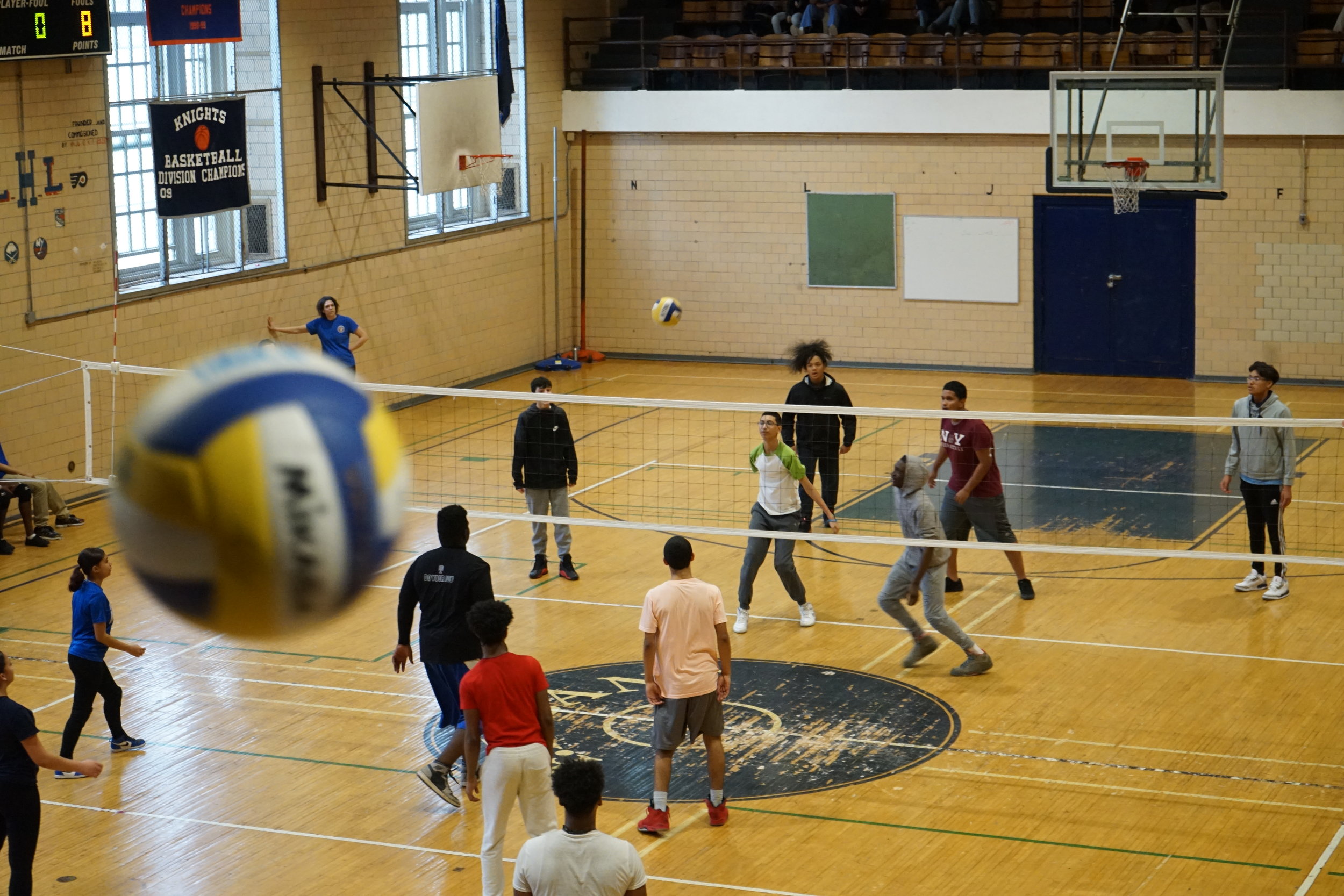 Students playing volleyball