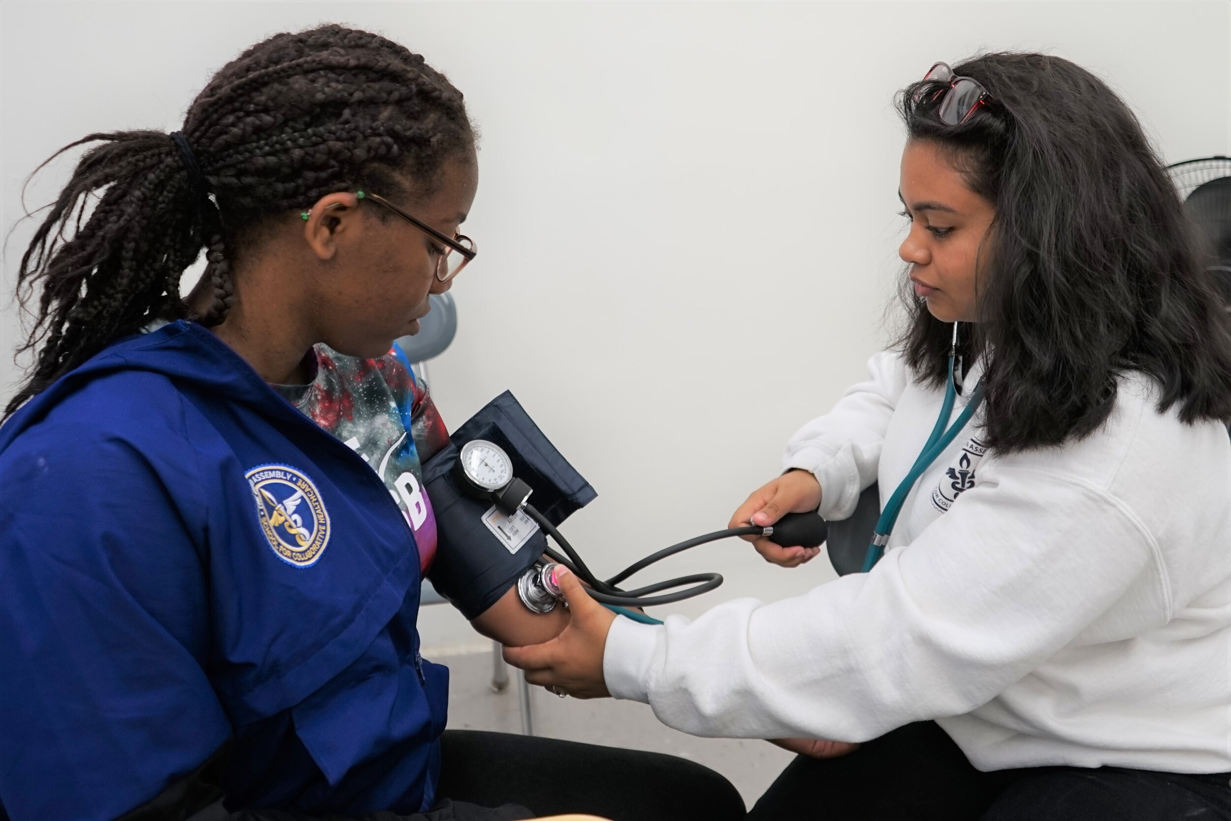 Student taking blood pressure