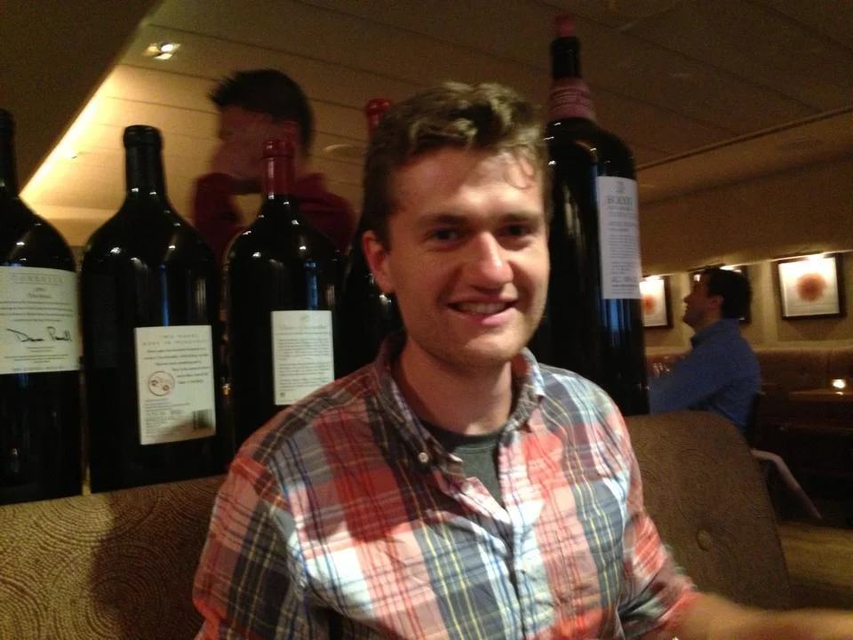 Patrick at Bar Boulud with the big bottles of wine