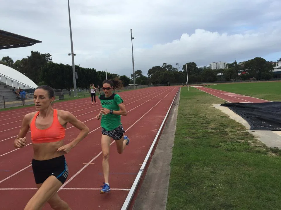 Madeline Heiner running loops on the track with me. She's a local Australian runner who can drop me no problem on the track!