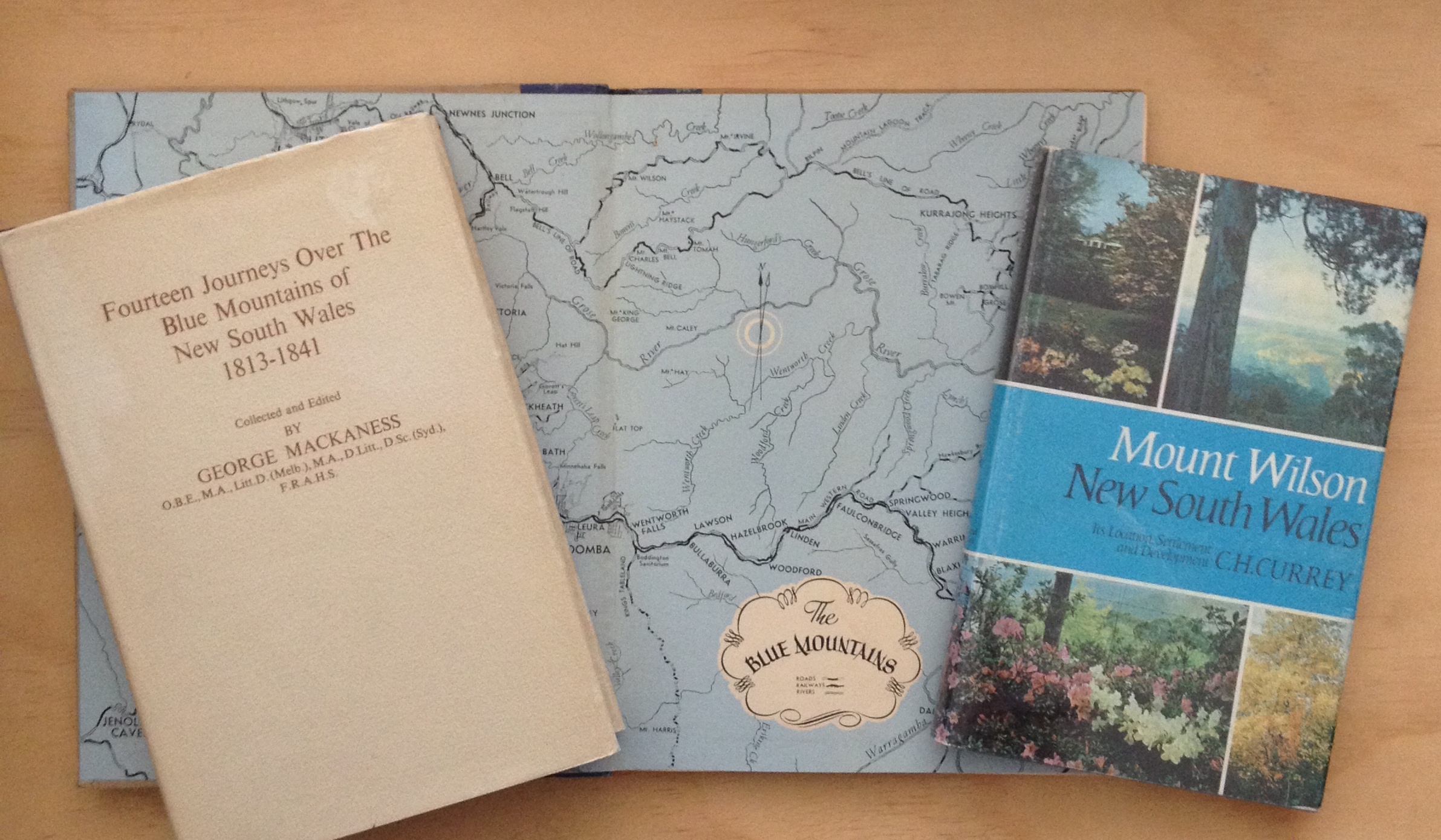 A selection of books on the Blue Mountains. The map forms the endpapers of Frank Hurley's Camera Study of The Blue Mountains and Jenolan Caves (Angus &amp; Robertson Sydney 1952)