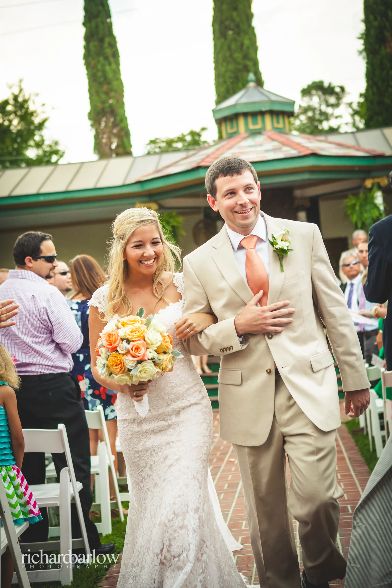 The ceremony was perfectly timed, as the brief rain showers started just as the ceremony ended. We all ducked inside until they passed and then continued with the photos and festivities!