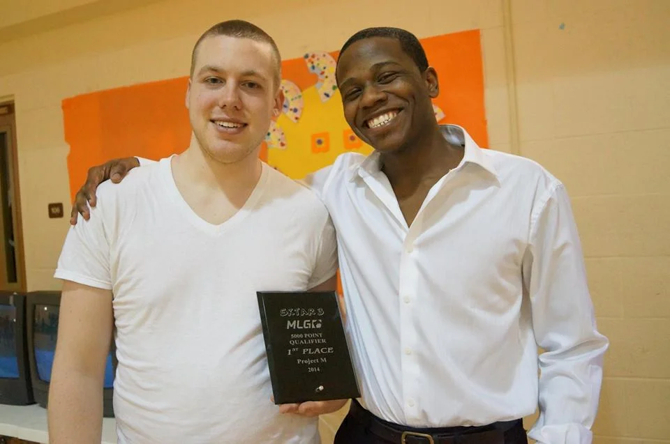 EmuKiller, left, awarded his first place Project M Singles plaque from Keitaro. 
