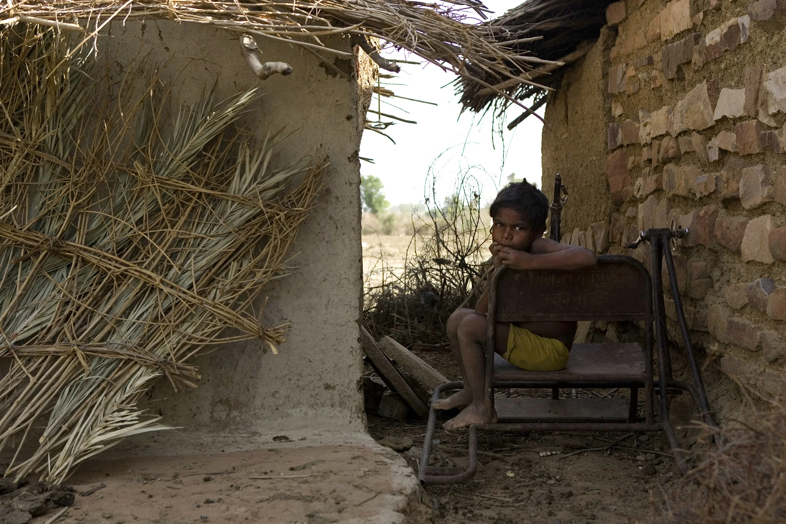  A young Adivasi boy in a village 20 kilometers from Shivpuri in Champal Valley, Wednesday, June 13th of 2007. Most of the 40 families of the village are landless and work as labourers for 50 rupees a day.  