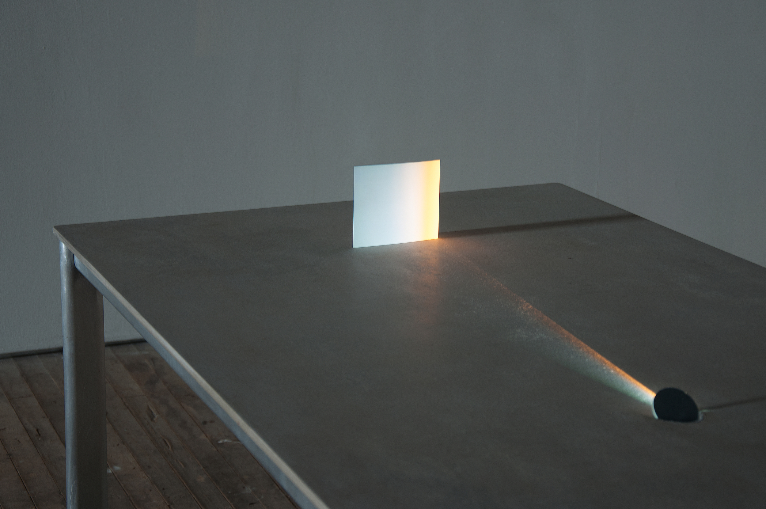 Movie for a table , concrete, aluminum, pico projector, mirrors, paper, 2013 (installation view ",,," Soap Factory, Minneapolis)