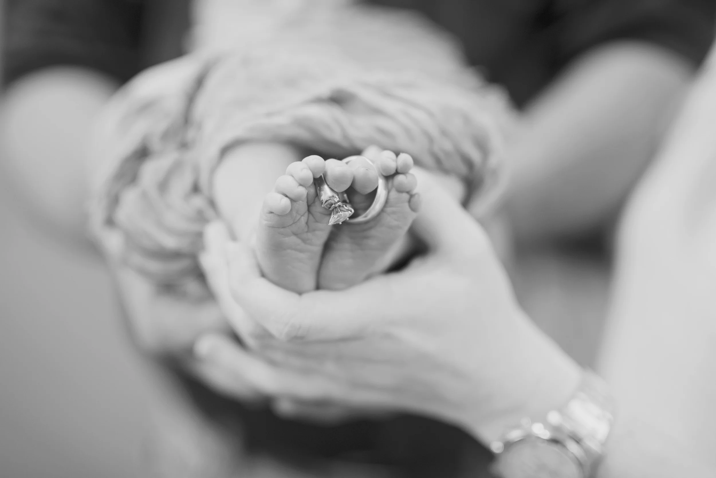 baby feet and wedding rings, newborn photos
