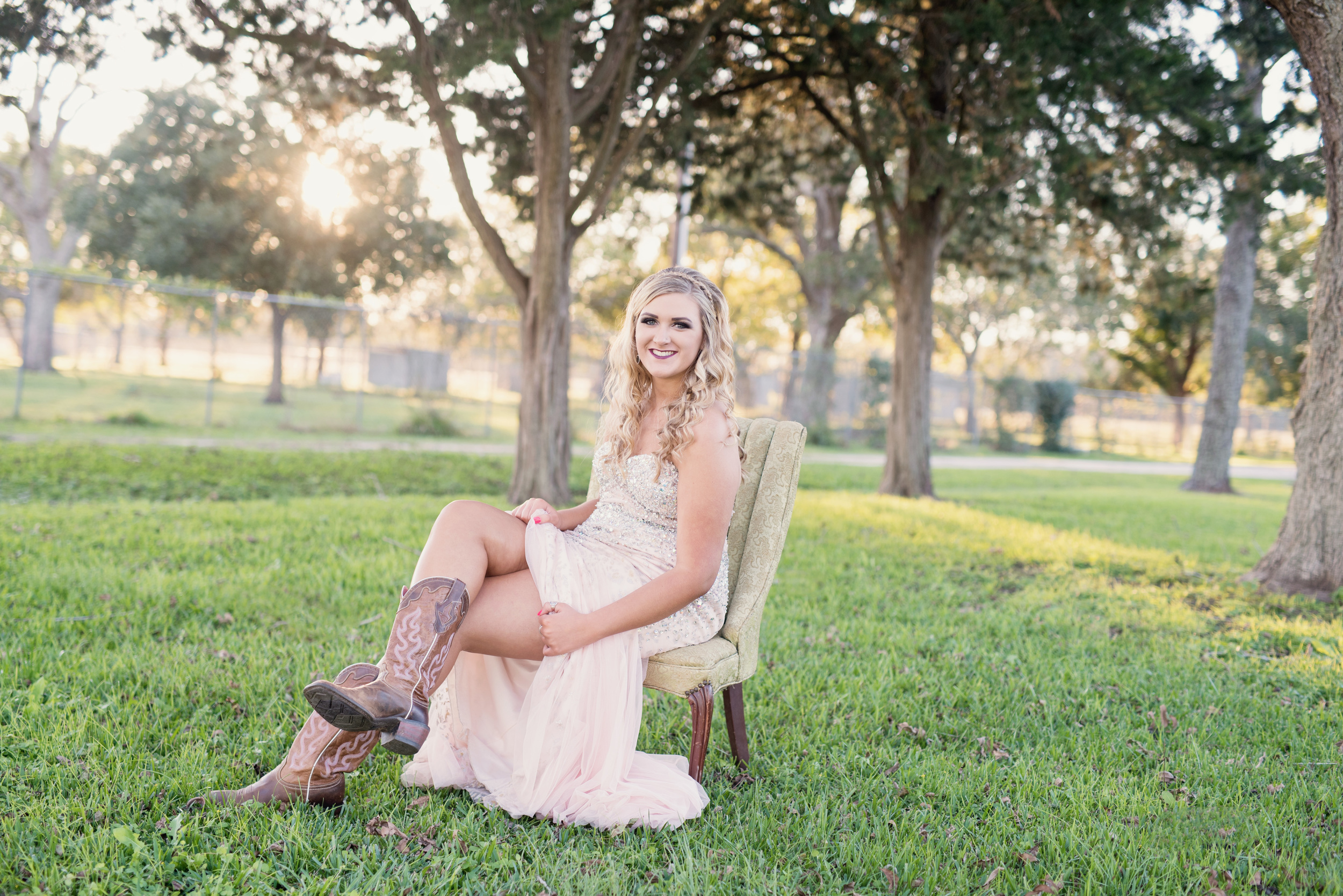 senior portraits in prom dress and boots