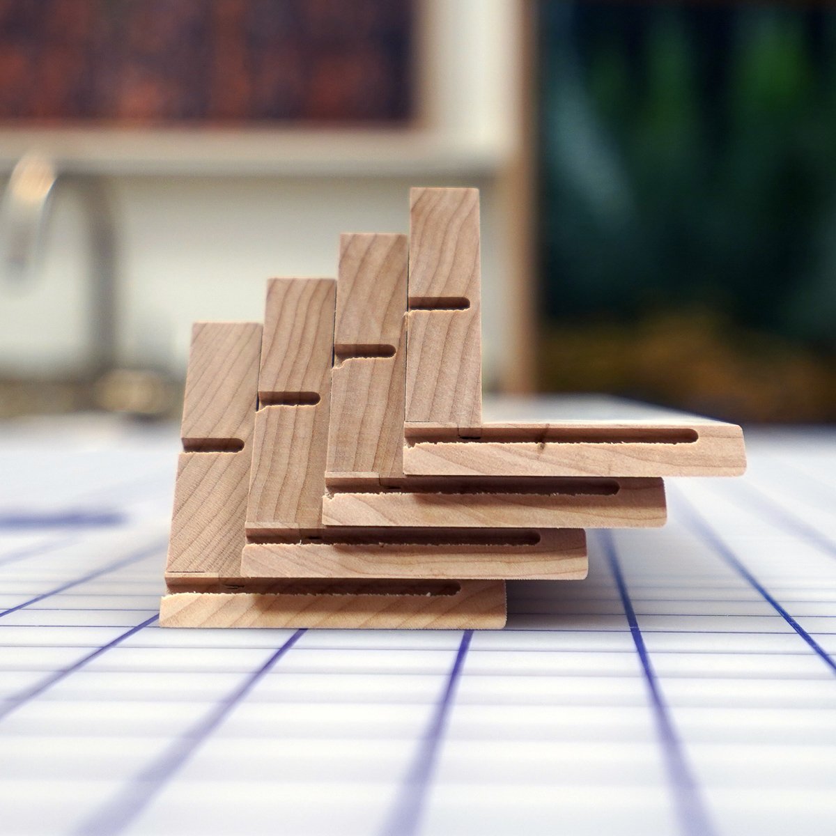  Here are the dovetail channels cut by the router. You can see how far they go up through the outside faces of the frame resulting in enormously strong corners. The shorter key in the thicker bottom just adds to the strength of the frame. 