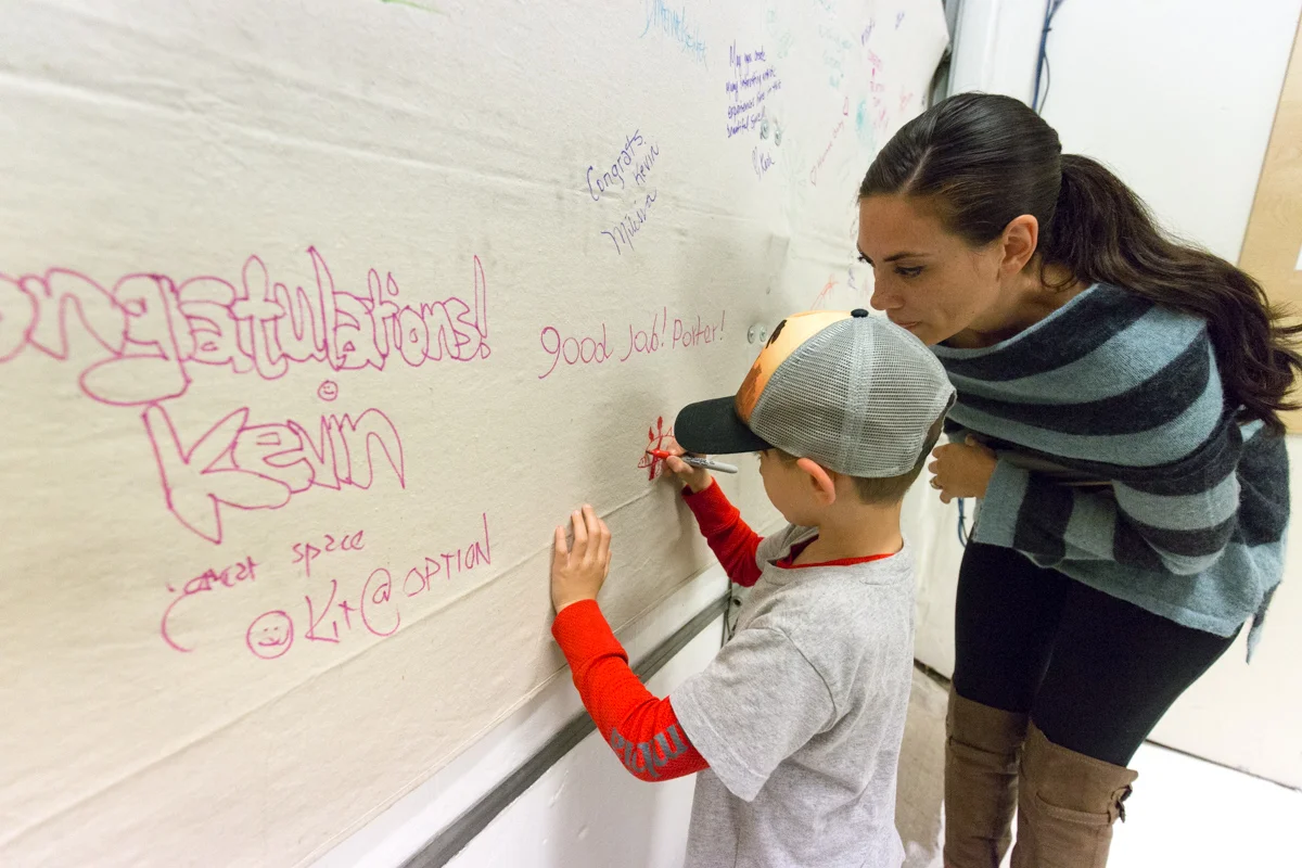 Signing the wall!