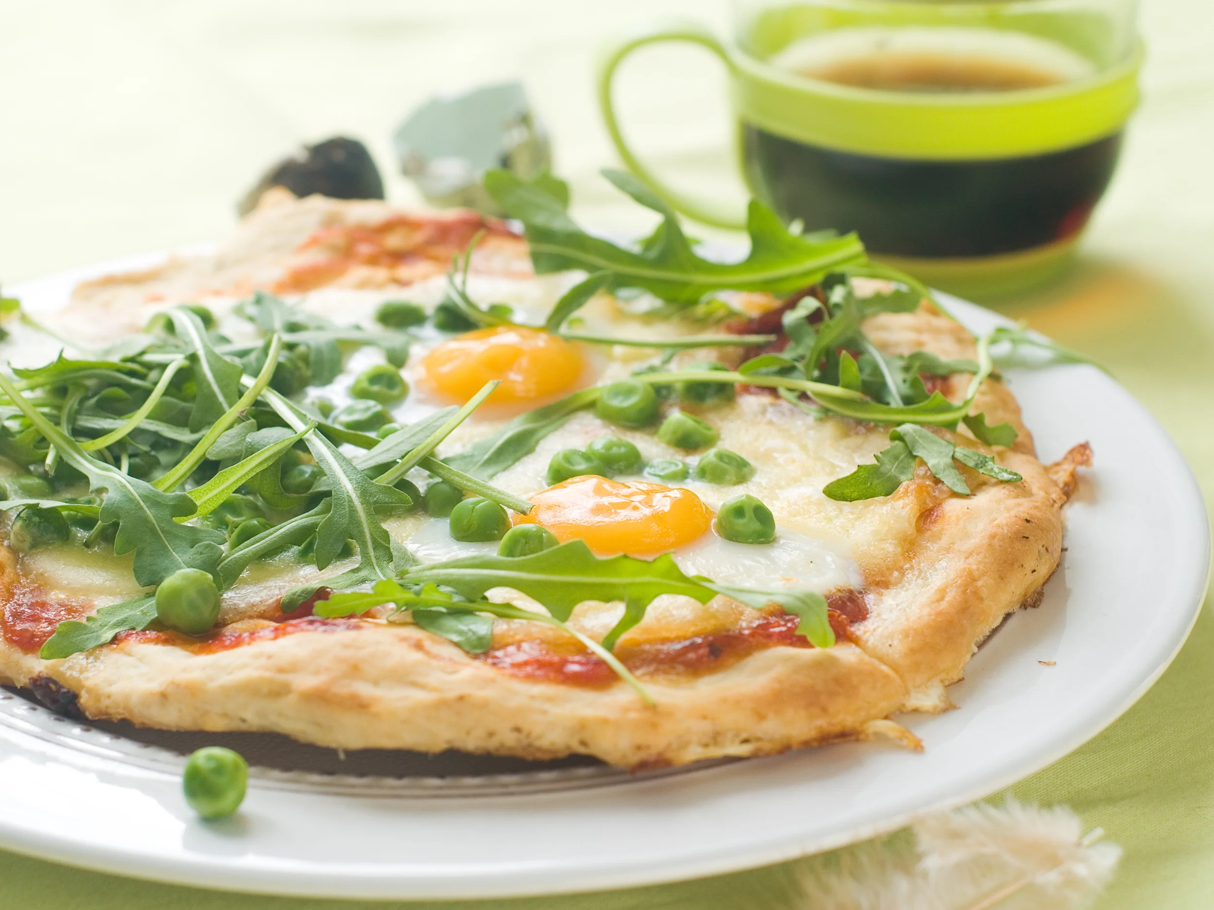Breakfast pizza with eggs, arugala, and sweet peas.jpg