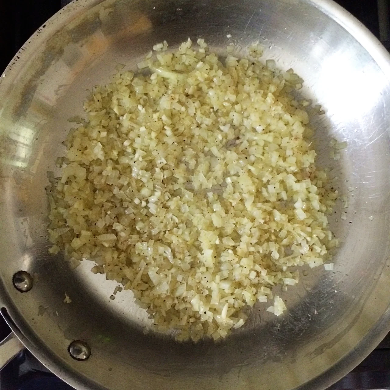 I chopped a fairly large onion and a few cloves of garlic and sautéed them in olive oil with salt & pepper until softened.