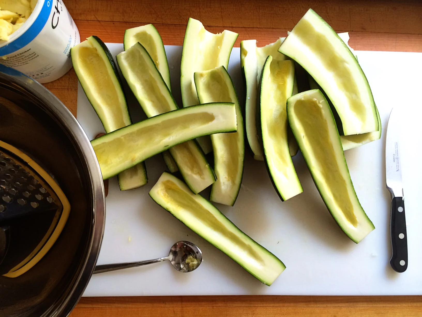 I halved, seeded and shredded all the zucchini (four small and one monster). It gave me way more than I thought I needed so I set two cups aside in the fridge for another use. I then measured three HEAPING cups.