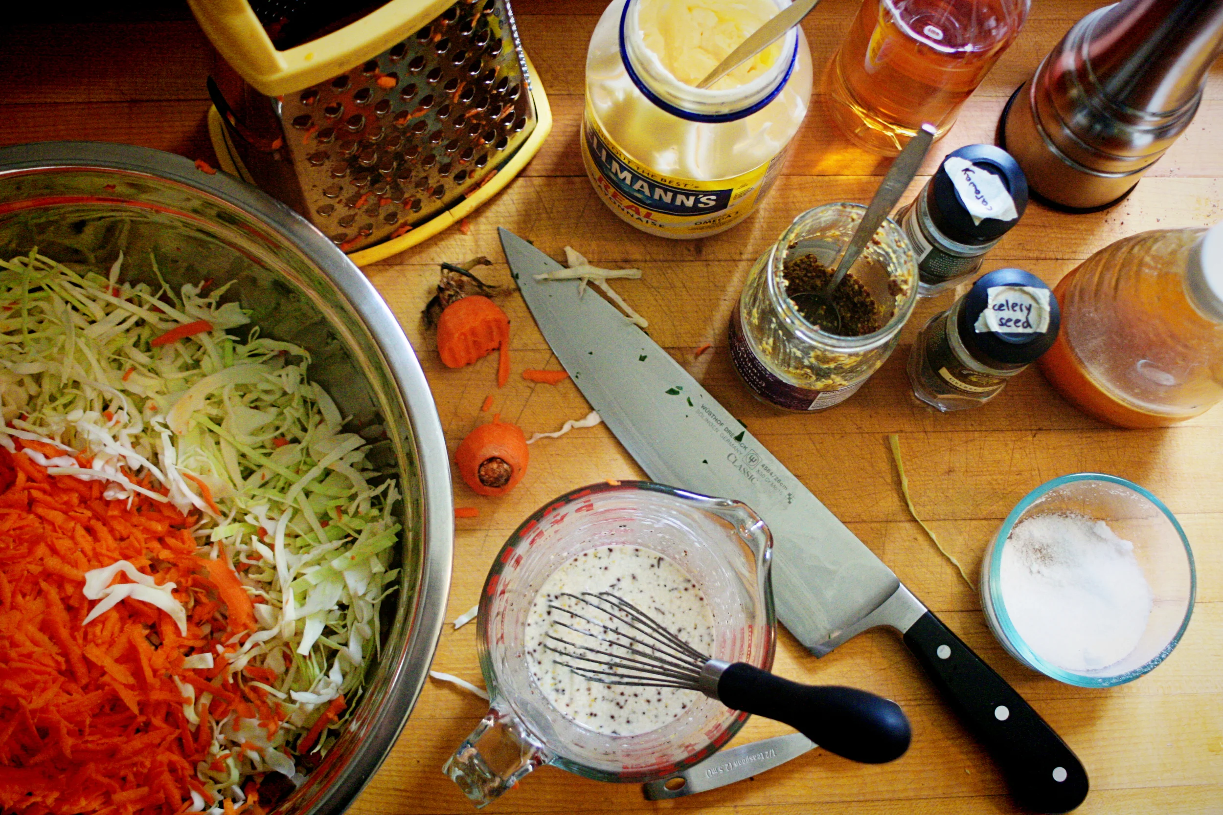 I thinly slice the cabbage ( a whole small or half a large) and shred 2 carrots on a box grater. The dressing is: 1 Tbs honey, ¼ cup cider vinegar, 1Tbs whole grain mustard, ½ tsp celery seed, 1 tsp caraway seed, 2 Tbs mayo, and salt & pepper to taste; whisked until smooth. 