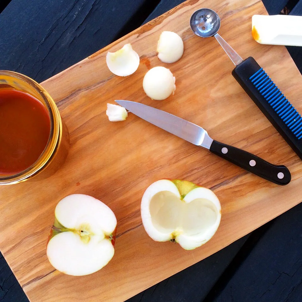 It is a fairly simple process. First use a melon baller to hollow out the apple. I chose a Cortland (again, from Soons ) because they don't brown quickly.