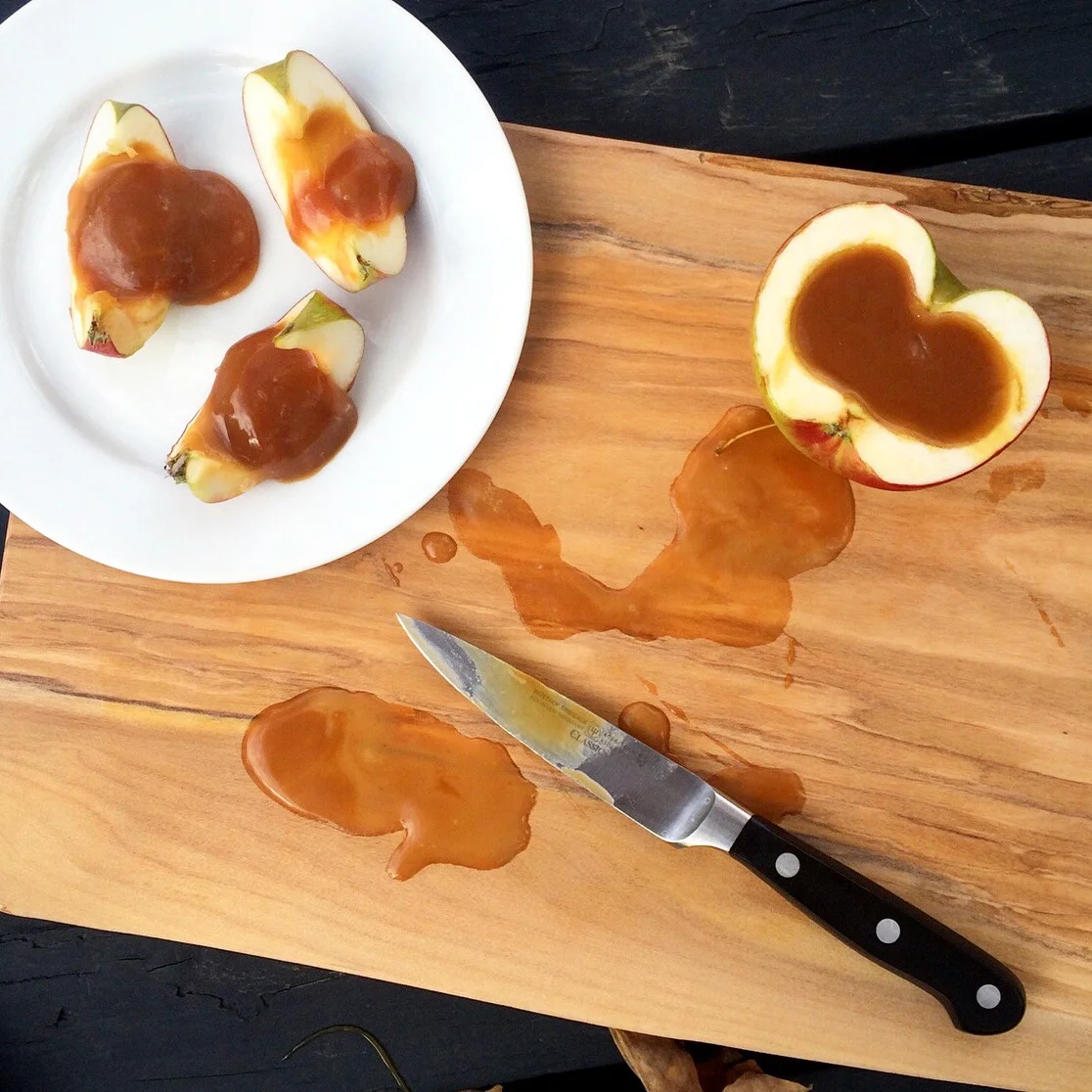 In the fridge, the caramel firms up so you can slice the filled apple halves for serving. Well, that's how it's supposed to happen. The caramel was indeed firm, but the bit where the caramel met the apple flesh was juicy, so everything slid around and was quite unattractive.