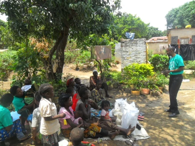 Stanley speaking to the TB/HIV/AIDS patients about the importance of a good nutrition to a TB/HIV client before the food distribution program started in Buchi Community