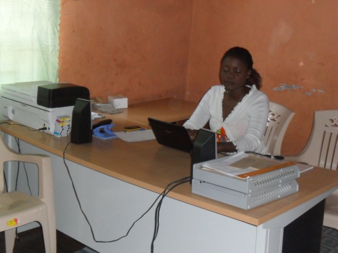 Mrs. Mwiche C. Bwalya CAM Community Programs Administrator working in the office at 3038 Kwacha East Kitwe