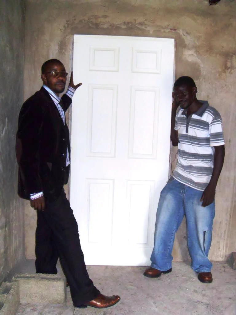 (L – R) Stanley and Cliff sizing the door in its frame and padlocks for the grill doors to ensure proper security
