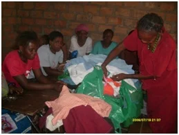 Catherine sorting out clothes in readiness for distribution to the patients