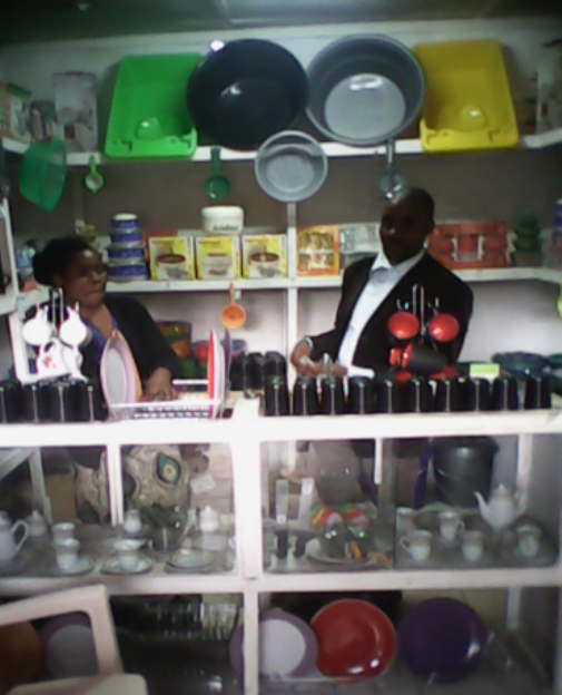 Mr. Stanley Mulenga and his wife Bernadette at the shop selling the kitchen ware merchandise
