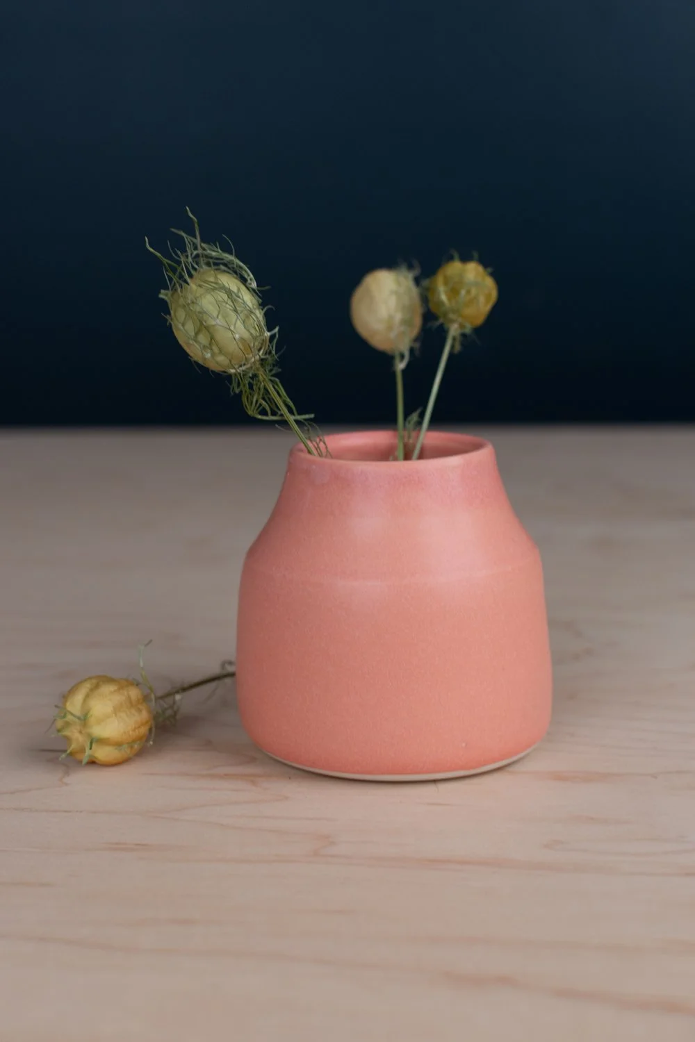 Warm pink glaze over creamy white porcelain.