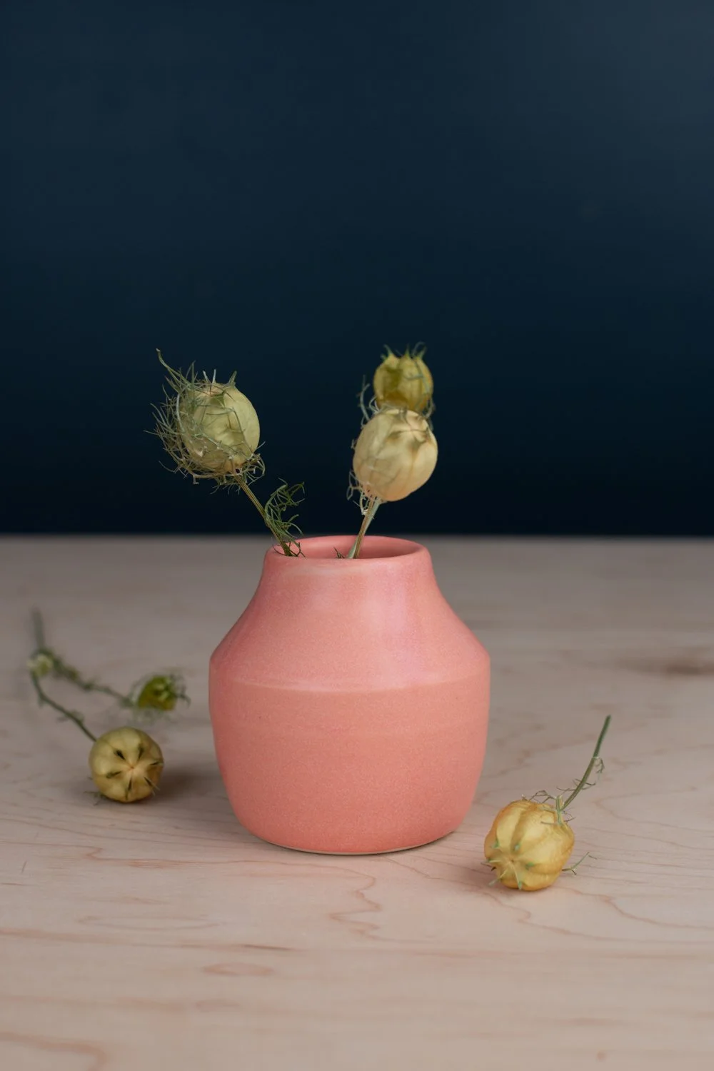 Warm pink glaze over creamy white porcelain.