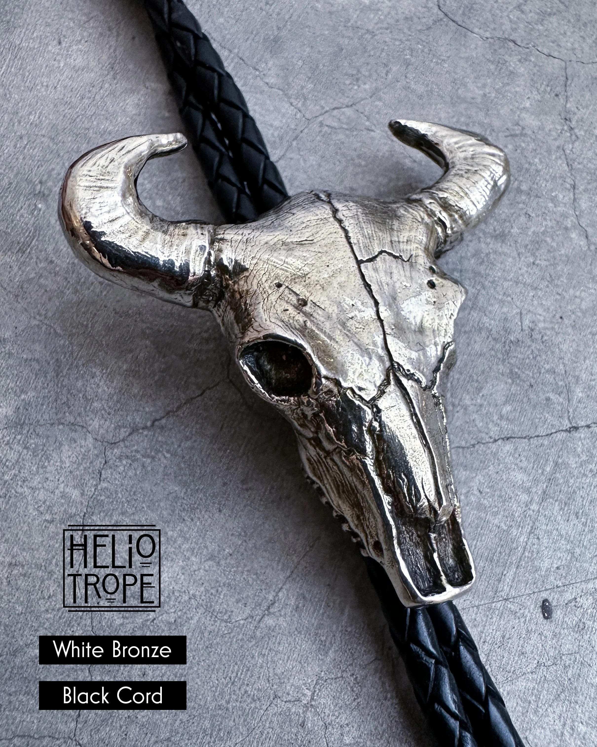 FullSizeRender_VSCO 26 bull skull bolo - white bronze black close.jpg