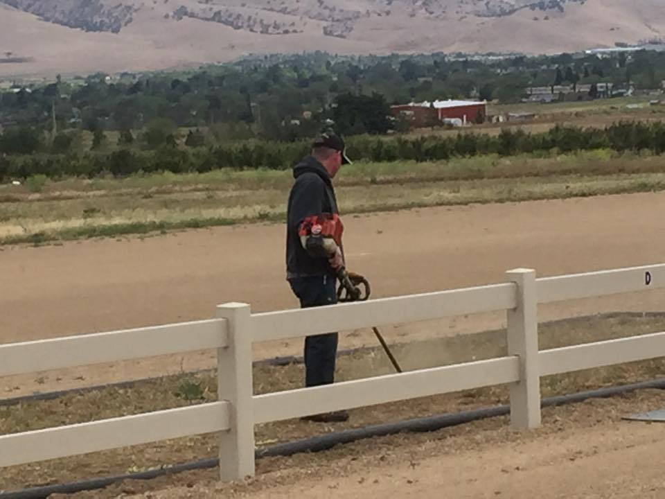 2016 President, Scott Wyatt, trimming the safety apron on a Field Cleanup Day in 2016.