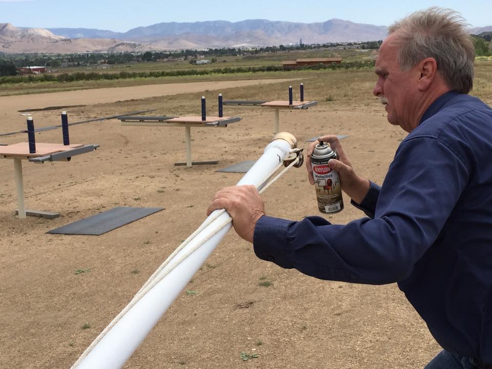 2014 Club President Bill Fisher touches up the finial.