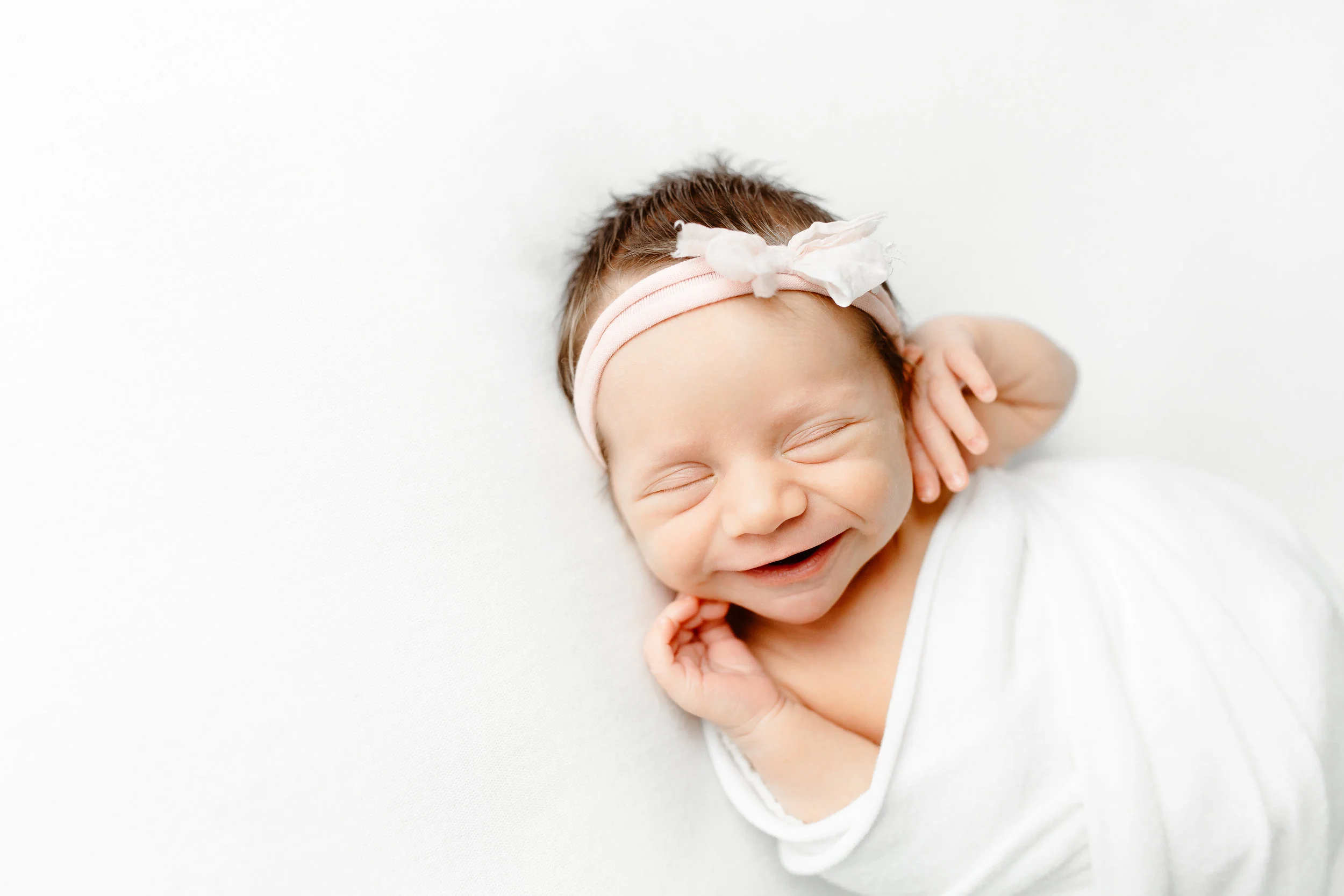 Sarah Cropper Photography is a Columbus newborn photographer who specializes in natural, lifestyle portraits of newborns and families in her Grove City residential studio. 